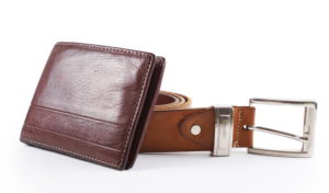 a brown leather wallet and a brown leather belt